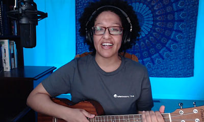 Can I use an app or software to detect guitar chords from a song playing in the background?