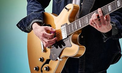 How can advanced guitarists improve their acoustic guitar playing skills?