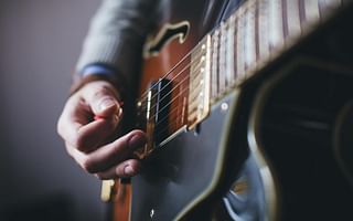 Should I find a guitar teacher or follow online tutorials to learn guitar?