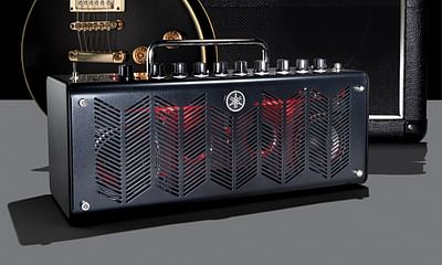 What should I do if I can't afford an amp for my electric guitar?