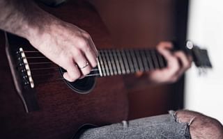 Why do some people progress faster than others when learning to play the guitar?